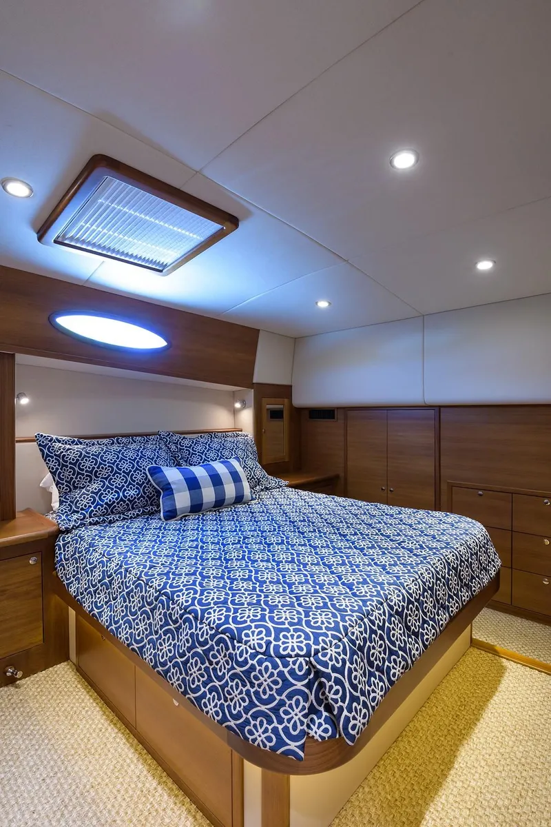 Slide: The Image of Laundry area inside 2018 Palm Beach Motor Yachts PB55, featuring Miele washer and dryer. - 4