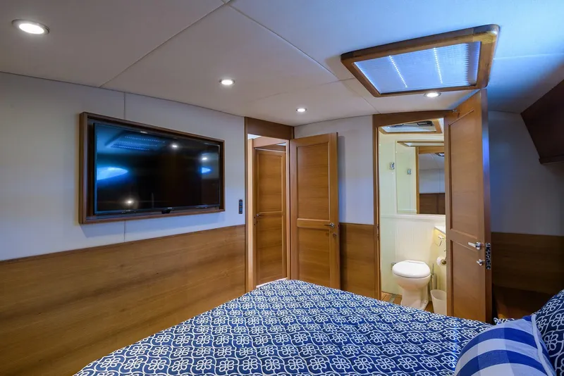 Slide: The Image of Luxurious bathroom in 2018 Palm Beach Motor Yachts PB55, featuring modern fixtures and elegant wood finishes. - 45