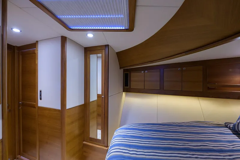 Slide: The Image of 2018 Palm Beach Motor Yachts PB55 cruising on open water, showcasing sleek design and performance. - 53