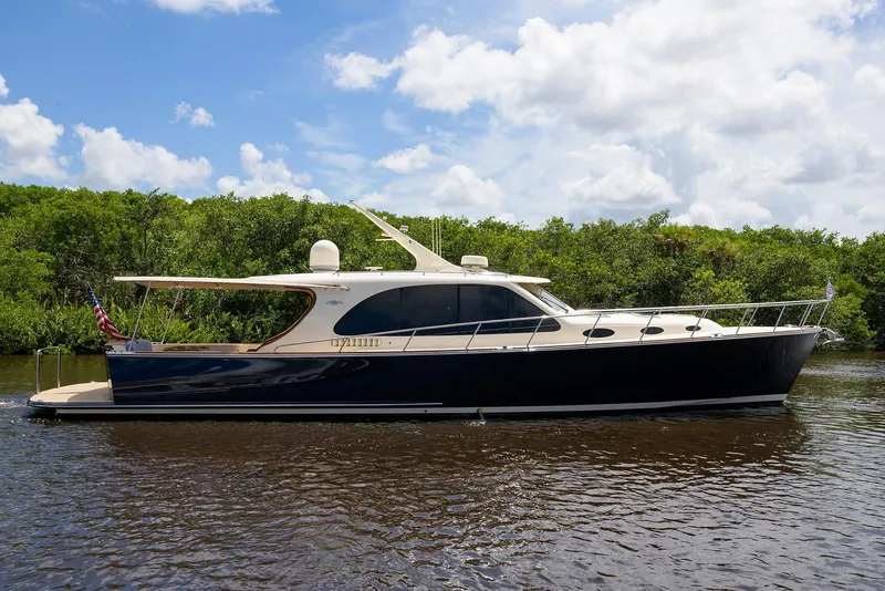 The Image of 2018 Palm Beach Motor Yachts PB55 cruising on open water. - 0