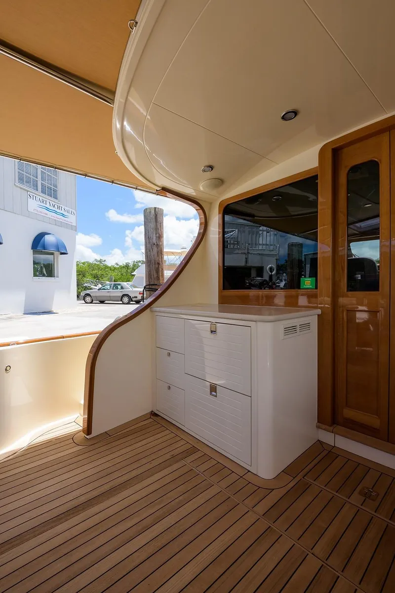 Slide: The Image of 2018 Palm Beach Motor Yachts PB55 bow with open hatch, showcasing anchor storage. - 16