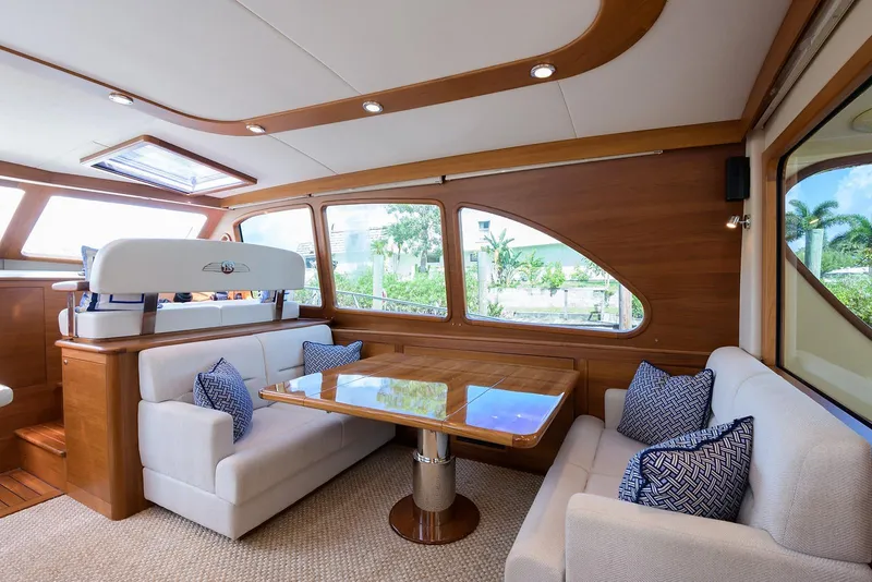 Slide: The Image of 2018 Palm Beach Motor Yachts PB55 helm with navigation display and controls. - 26