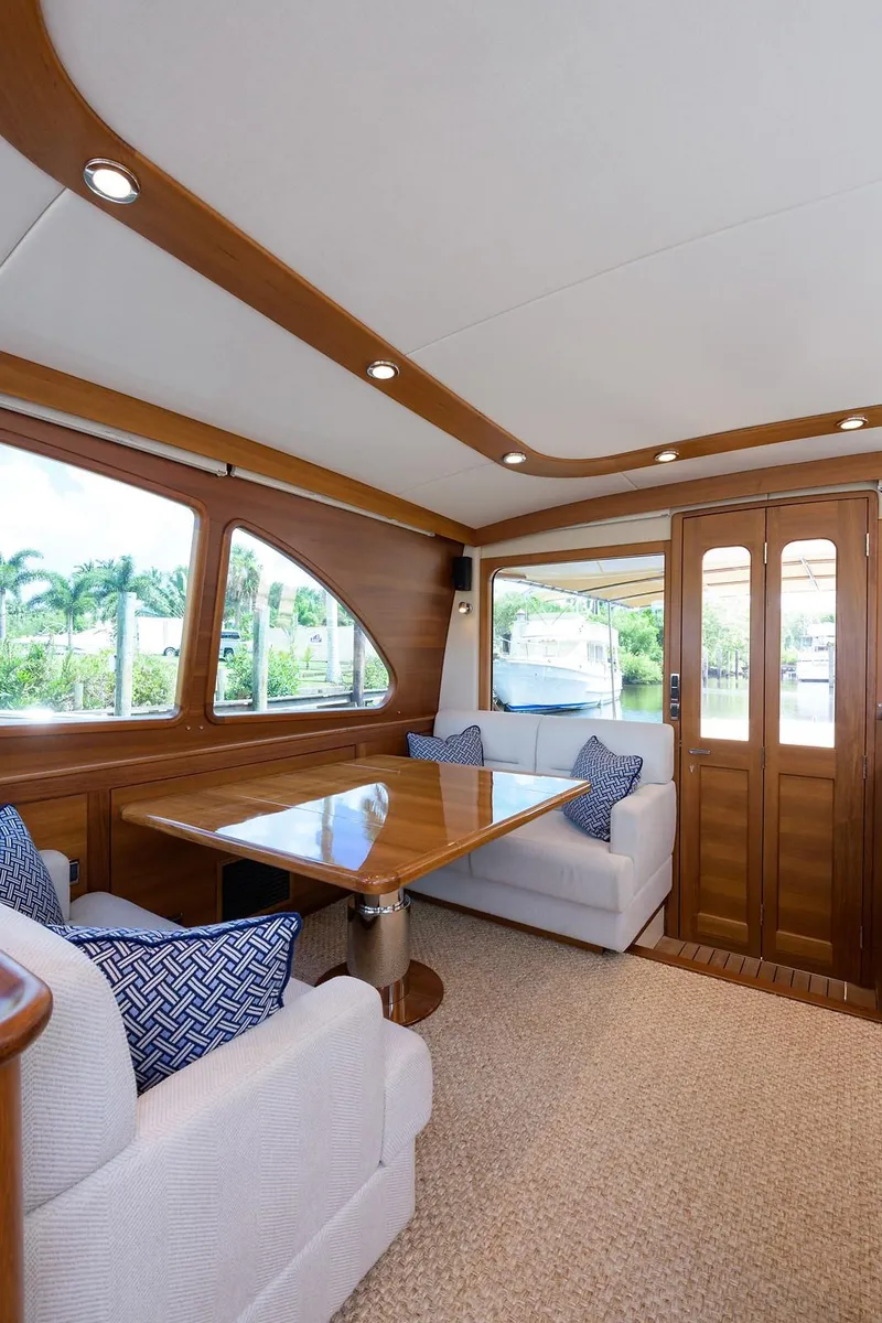 Slide: The Image of 2018 Palm Beach Motor Yachts PB55 engine room with wooden flooring and equipment. - 28