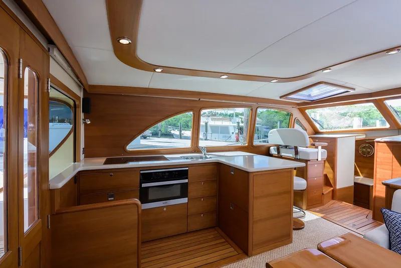 Slide: The Image of Laundry area inside 2018 Palm Beach Motor Yachts PB55, featuring Miele washer and dryer. - 31