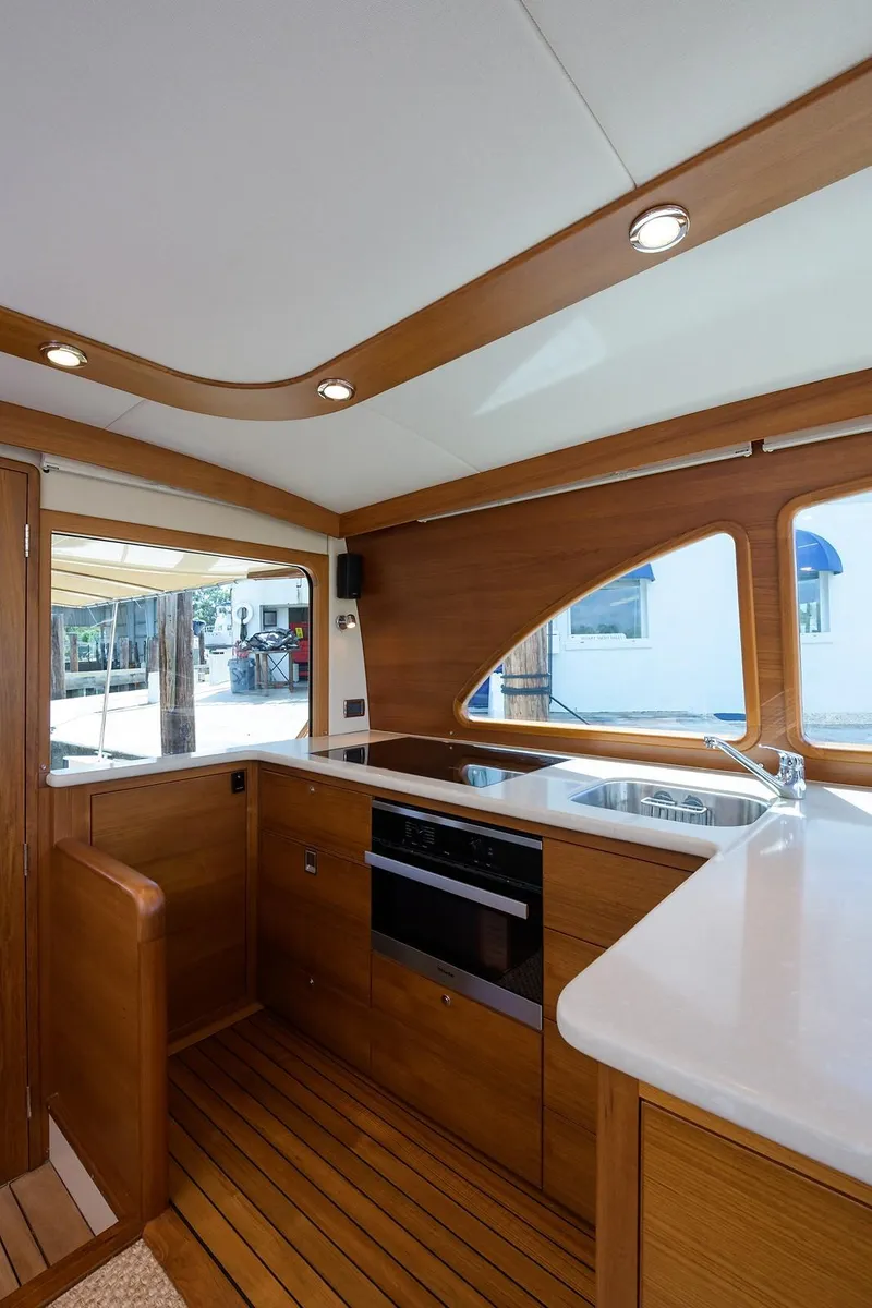 Slide: The Image of Luxurious cabin interior of 2018 Palm Beach Motor Yachts PB55 with elegant wood finish. - 34