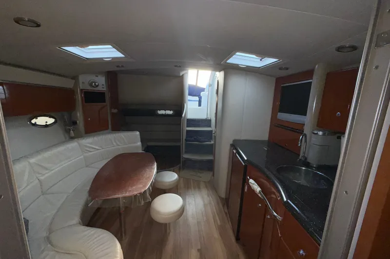 Slide: The Image of Luxurious interior of a 2006 Formula 40 Performance Cruiser with modern amenities and elegant design. - 13