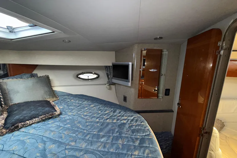 Slide: The Image of Interior cabin of 2006 Formula 40 Performance Cruiser with bed, TV, and porthole window. - 15