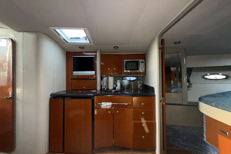 Slide: The Image of Interior of 2006 Formula 40 Performance Cruiser with kitchenette and modern amenities. - 18