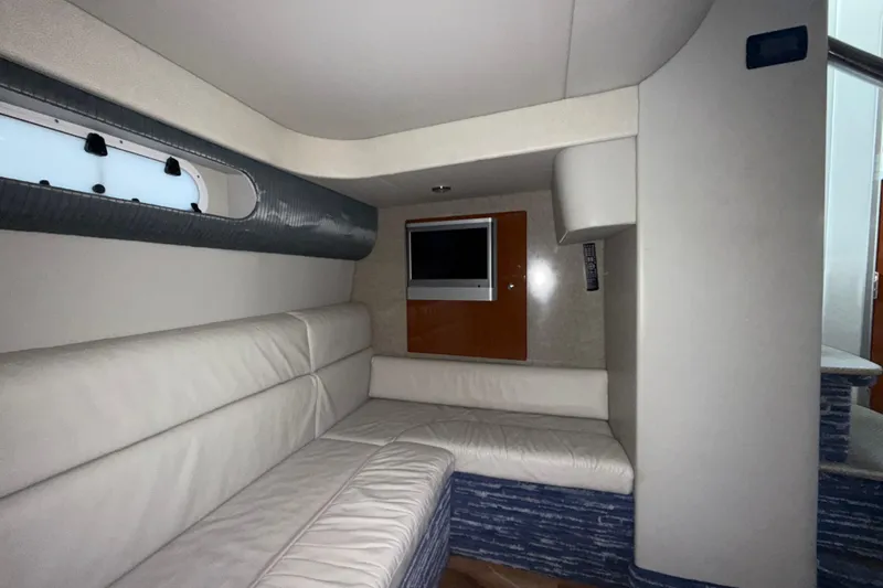 Slide: The Image of 2006 Formula 40 Performance Cruiser interior with white leather seating and wall-mounted TV. - 21