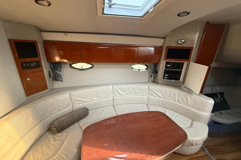 Slide: The Image of Interior of 2006 Formula 40 Performance Cruiser with white leather seating and wooden cabinetry. - 23