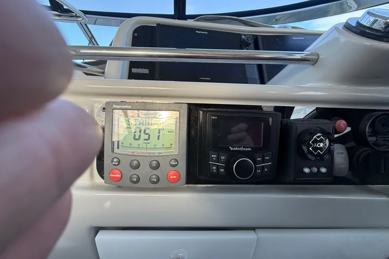 Slide: The Image of Control panel of a 2006 Formula 40 Performance Cruiser with navigation and audio systems. - 24