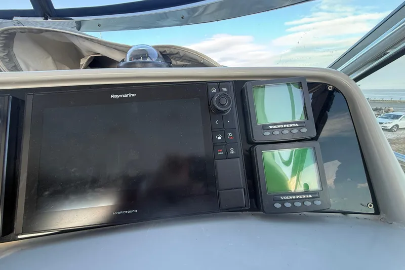 Slide: The Image of Control panel of a 2006 Formula 40 Performance Cruiser with Raymarine and Volvo Penta displays. - 25