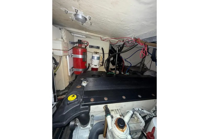 Slide: The Image of Engine room of a 2006 Formula 40 Performance Cruiser with visible wiring and components. - 31