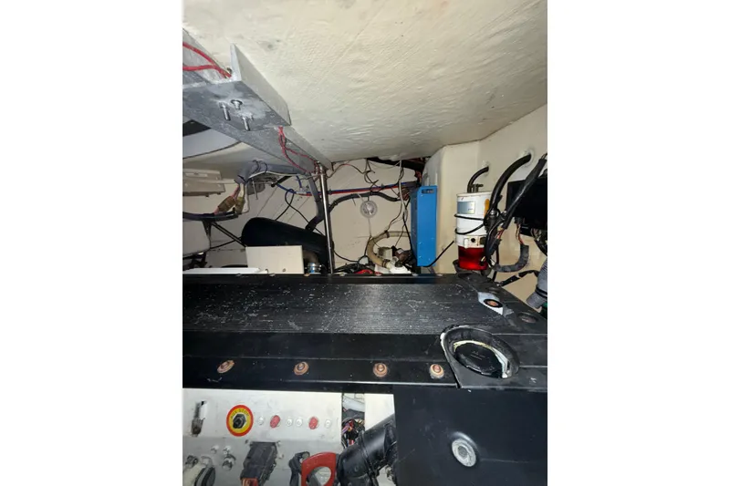 Slide: The Image of Engine room of a 2006 Formula 40 Performance Cruiser with visible wiring and components. - 32