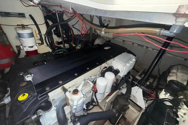 Slide: The Image of Engine room of a 2006 Formula 40 Performance Cruiser with visible wiring and components. - 36