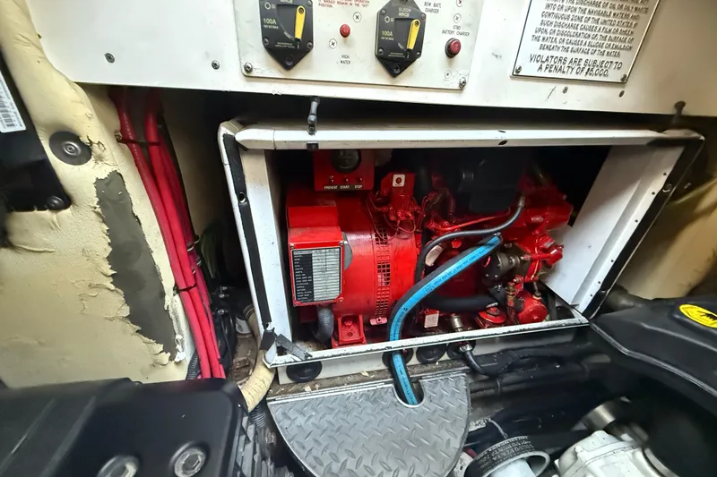 Slide: The Image of Engine compartment of a 2006 Formula 40 Performance Cruiser with visible wiring and components. - 37