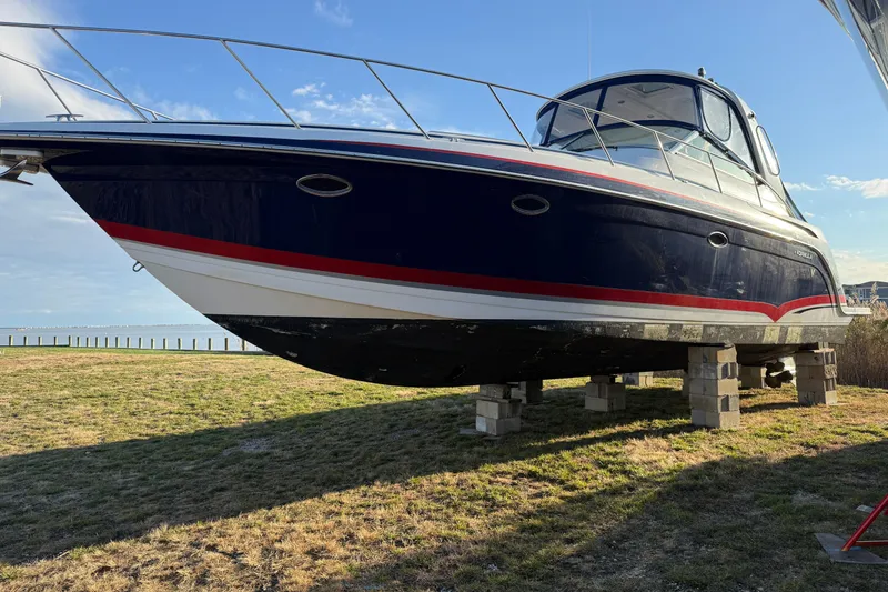 Slide: The Image of 2006 Formula 40 Performance Cruiser on blocks, side view, outdoors. - 39