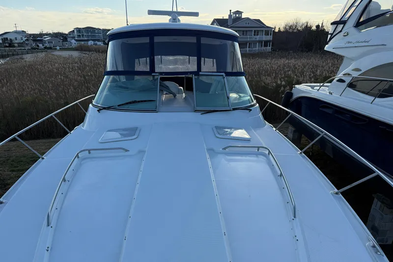 Slide: The Image of 2006 Formula 40 Performance Cruiser docked near waterfront homes. - 6