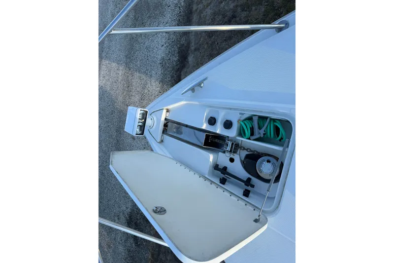 Slide: The Image of Open anchor compartment on 2006 Formula 40 Performance Cruiser, showing anchor chain and storage. - 7