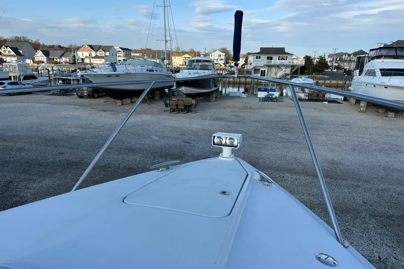 Slide: The Image of 2006 Formula 40 Performance Cruiser in marina, surrounded by boats and waterfront homes. - 8