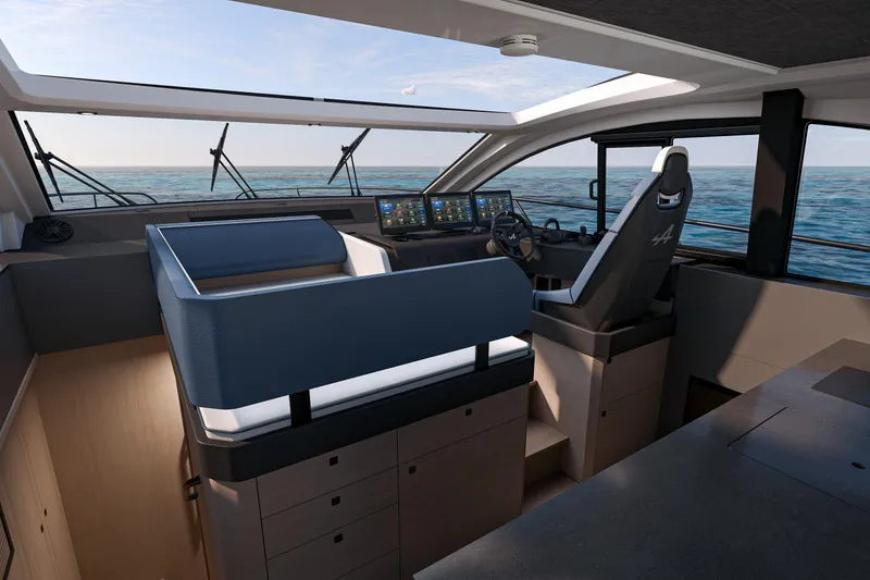 Slide: The Image of Interior of 2026 Beneteau Gran Turismo 50 yacht, featuring modern helm and ocean view. - 15