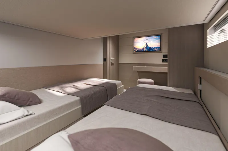 Slide: The Image of Luxurious cabin interior of 2026 Beneteau Gran Turismo 50 yacht with twin beds and TV. - 18
