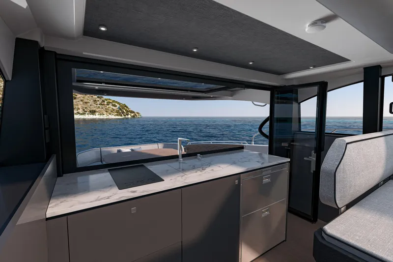 Slide: The Image of Interior view of 2026 Beneteau Gran Turismo 50 yacht with ocean backdrop. - 9