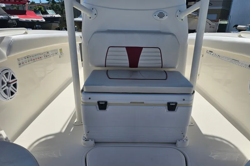 Slide: The Image of 2015 Wellcraft 252 Fisherman boat interior with cushioned seating and storage. - 12