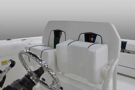 Slide: The Image of Manufacturer Provided Image: 2015 Wellcraft 252 Fisherman boat helm seating and steering wheel. - 13