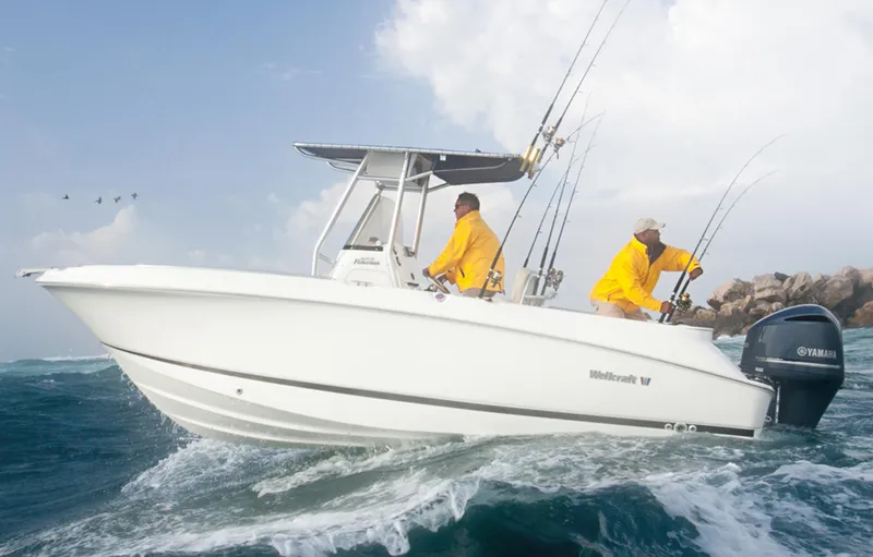 Slide: The Image of Manufacturer Provided Image: 2015 Wellcraft 252 Fisherman boat on the water with two anglers in yellow jackets. - 16