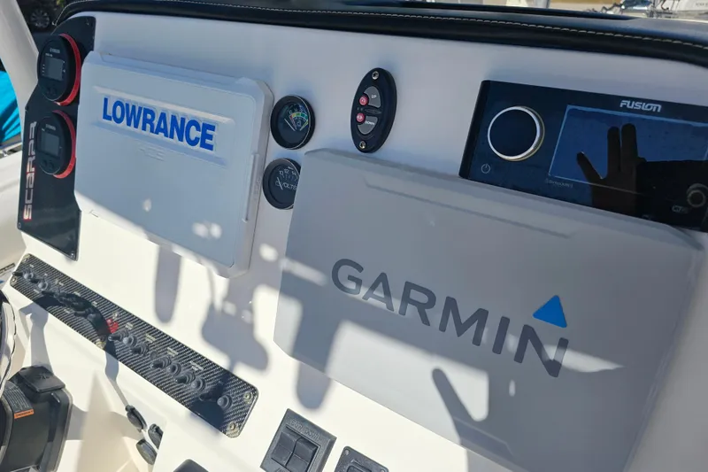 Slide: The Image of Storage compartment of a 2015 Wellcraft 252 Fisherman boat with radio equipment. - 22