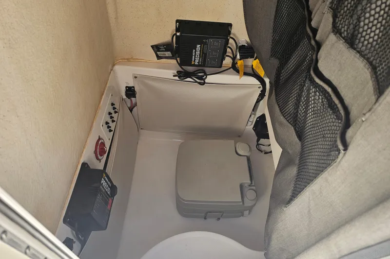 Slide: The Image of 2015 Wellcraft 252 Fisherman boat with Scarab 25 logo on white surface. - 25