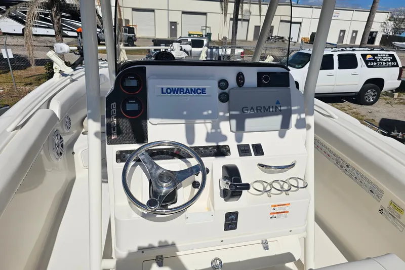 Slide: The Image of 2015 Wellcraft 252 Fisherman boat interior with foldable seating and storage. - 28