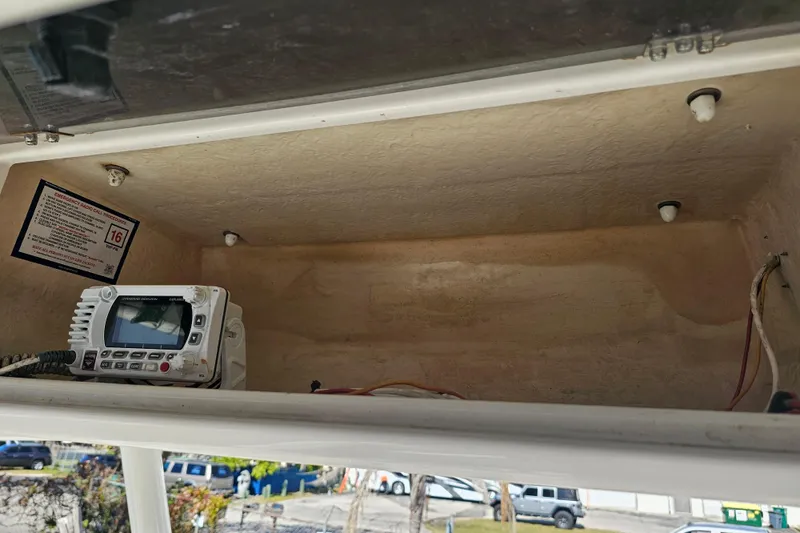 Slide: The Image of 2015 Wellcraft 252 Fisherman dashboard with Garmin and Fusion electronics. - 32