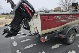 Slide: The Image of 2004 Crestliner 1750 Fish Hawk SC boat with Mercury outboard motor on a trailer. - 5