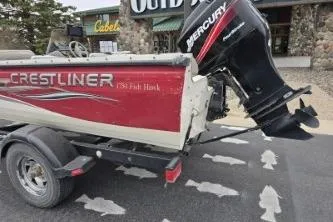 Slide: The Image of 2004 Crestliner 1750 Fish Hawk SC boat with Mercury outboard motor on trailer. - 6