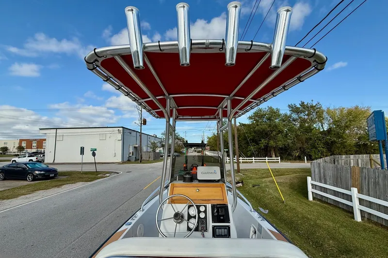 Slide: The Image of 1997 Boston Whaler 17 Outrage II with red canopy and Garmin navigation system. - 10