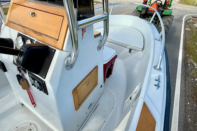 Slide: The Image of 1997 Boston Whaler 17 Outrage II boat interior with console and seating. - 13
