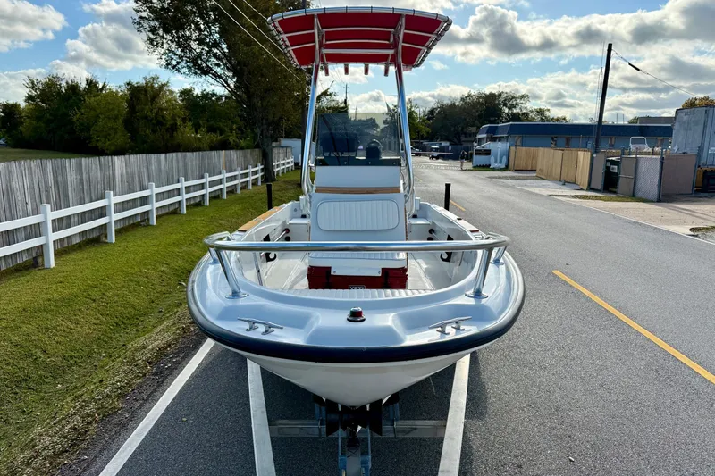 Slide: The Image of 1997 Boston Whaler 17 Outrage II boat on trailer, parked on roadside. - 5