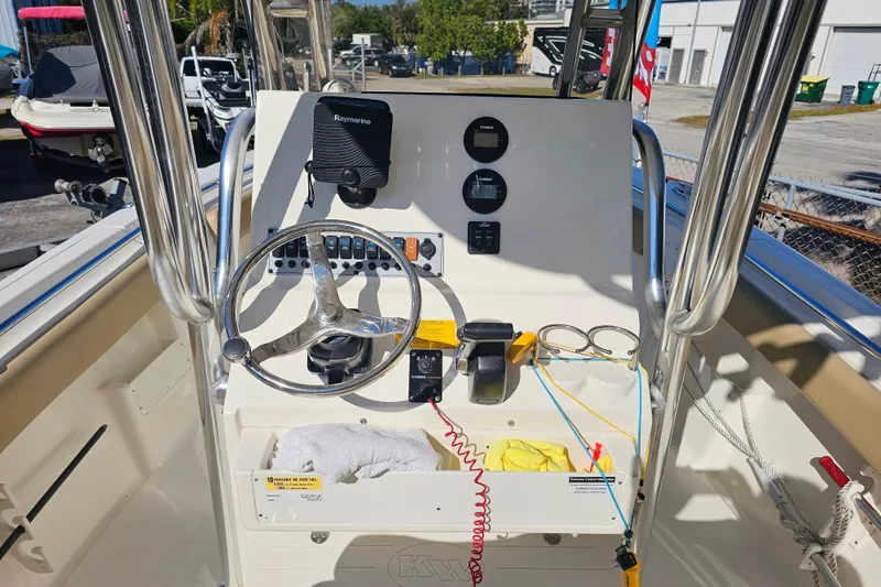 Slide: The Image of 2017 Key West 239 FS boat console with steering wheel and navigation equipment. - 11
