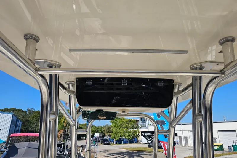 Slide: The Image of 2017 Key West 239 FS boat interior with stainless steel framework and overhead storage. - 12