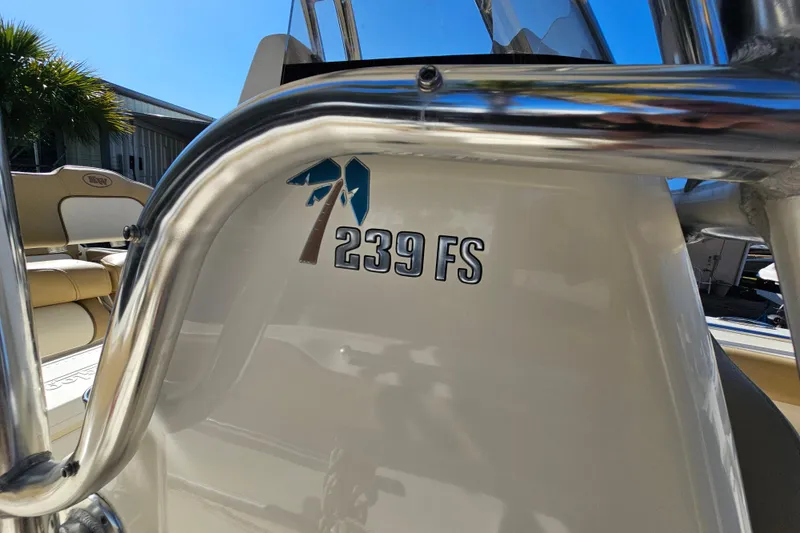 Slide: The Image of 2017 Key West 239 FS boat with stainless steel railing and logo detail. - 16