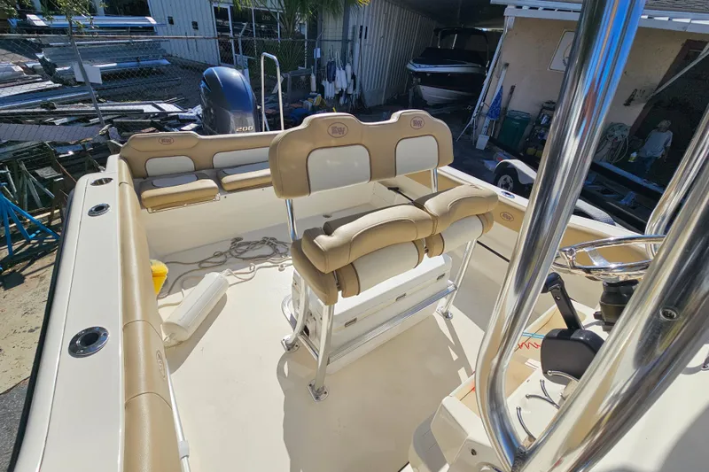 Slide: The Image of 2017 Key West 239 FS boat interior with seating and controls. - 19