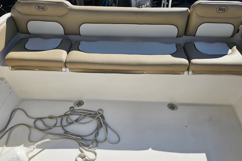 Slide: The Image of 2017 Key West 239 FS boat interior with beige seating and coiled rope. - 20