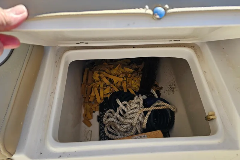 Slide: The Image of Storage compartment of 2017 Key West 239 FS boat with ropes and equipment. - 22