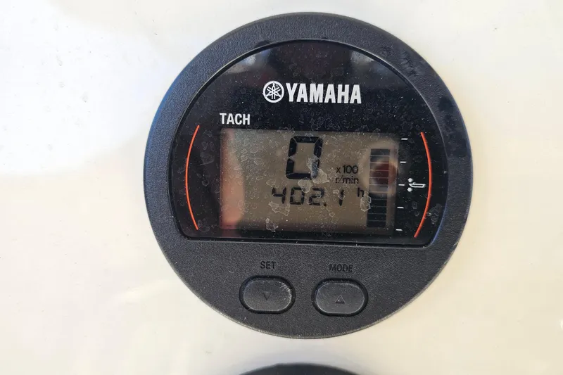 Slide: The Image of Yamaha tachometer displaying 0 RPM and 402.1 hours on a 2017 Key West 239 FS boat. - 24