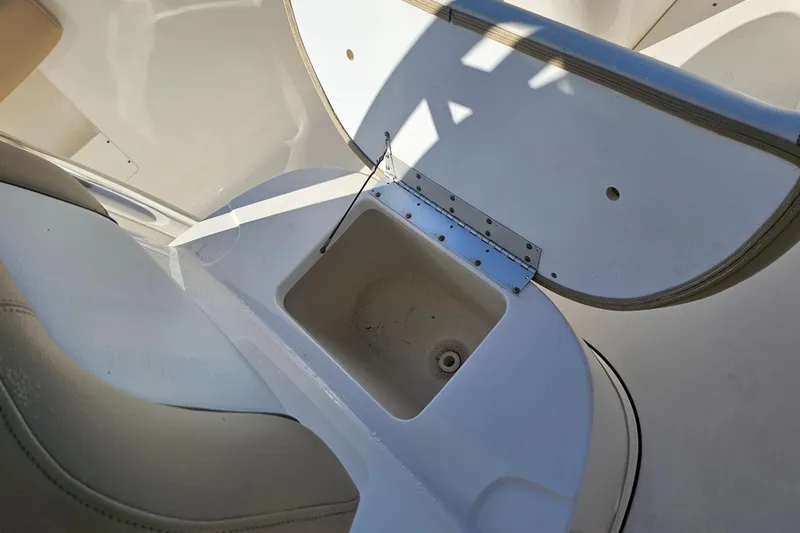 Slide: The Image of 2017 Key West 239 FS boat interior with open storage compartment. - 25