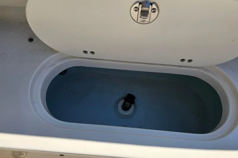 Slide: The Image of Open storage compartment on 2017 Key West 239 FS boat. - 26