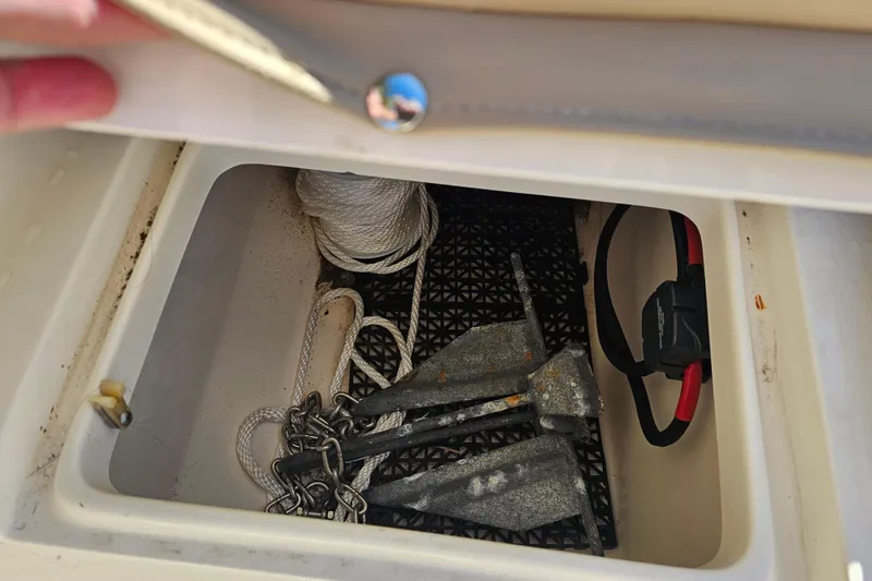Slide: The Image of Storage compartment of 2017 Key West 239 FS boat with anchors and rope. - 27