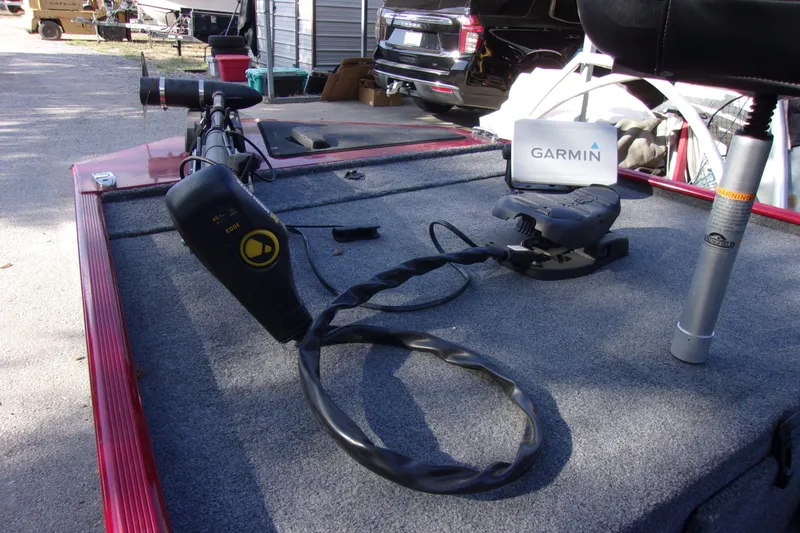 Slide: The Image of 2024 Bass Tracker Classic XL boat deck with Garmin navigation system and trolling motor. - 11